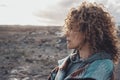 One woman outdoor looking landscape in front of her with serious expression. People exploring outdoors concept leisure activity.