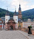 Solitary Female Walks over Theordore Bridge in Heidelberg, Germany