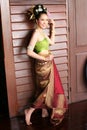 One woman in THAI RETRO DRESS is posing for a photograph.