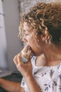 One woman working on laptop and eating a sandwich for lunch break time. Modern people work on computer at home. Alternative office Royalty Free Stock Photo