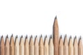 One wood pencil standing out from the row