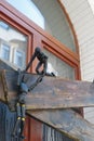 One wooden articulated black mannequin rescues another