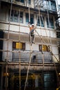 One worker building a bamboo scaffolding in hong kong, china