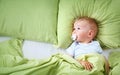 One year old baby in the bed Royalty Free Stock Photo