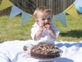 One year old baby boy chocolate cake smash Royalty Free Stock Photo