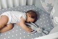 One year old baby boy lying in a round bed Royalty Free Stock Photo
