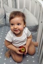 One year old baby boy sitting in bed Royalty Free Stock Photo