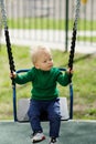 One year old baby boy toddler wearing green sweater at playground Royalty Free Stock Photo