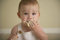 Gorgeous happy blue eyed baby boy in neutral tones turns one Royalty Free Stock Photo