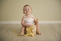 Gorgeous happy blue eyed baby boy in neutral tones turns one Royalty Free Stock Photo