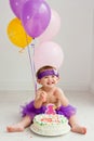 One year old birthday girl with cake Royalty Free Stock Photo
