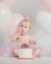 One Year Old Birthday Portraits with smash cake and balloons Royalty Free Stock Photo