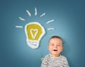 One year old boy and a bulb near. Child with an idea Royalty Free Stock Photo