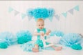 A one-year-old boy celebrates his first birthday, holds the letter E in his hands and smiles Royalty Free Stock Photo