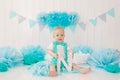 A one-year-old boy celebrates his first birthday, holds the letter N in his hands and smiles Royalty Free Stock Photo