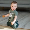One year old boy is kneeling. Royalty Free Stock Photo
