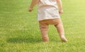 A one-year-old child is learning to walk Royalty Free Stock Photo