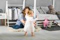 One year old girl playing near in the room with a toy horse, ska Royalty Free Stock Photo