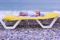 One year old newborn baby boy sleeping in the beach Royalty Free Stock Photo