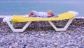 One year old newborn baby boy sleeping in the beach Royalty Free Stock Photo