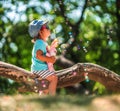 One years old little girl blowing soap bubbles in summer park Royalty Free Stock Photo