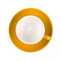 One yellow empty coffee or tea cup with saucer isolated on white background Royalty Free Stock Photo