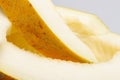One yellow honeydew melon slice without seeds Royalty Free Stock Photo