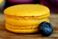 One yellow macaron closeup