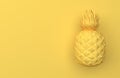 One yellow pineapple isolated on a yellow background with space for text. Tropical exotic fruit. Front view. 3D rendering.