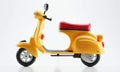 One yellow plastic scooter on a white background, a toy Royalty Free Stock Photo
