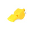 One yellow plastic whistle isolated on white Royalty Free Stock Photo