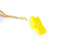 One yellow whistle with orange cord isolated on white Royalty Free Stock Photo