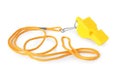 One yellow whistle with orange cord isolated on white Royalty Free Stock Photo