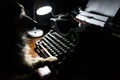 One yorkshire dog writes on an ancient typewriter.