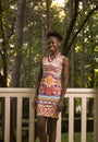 one, young adult, black african american happy smiling woman 20-29 years, standing, looking to camera, outdoors park Royalty Free Stock Photo