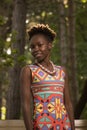 one, young adult, black african american happy smiling woman 20-29 years, standing, looking to camera, outdoors park