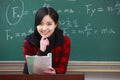 One young asian female teacher in the classroom