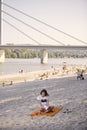 One young girl, relaxing reading a book outdoors, beach Royalty Free Stock Photo