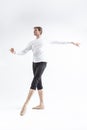 One Young, Handsome, Sporty Athletic Ballet Dancer with Ballanced Hands on White