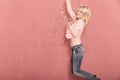 One young happy woman, jumping in air, with confetti falling, Royalty Free Stock Photo