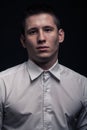 One young man, face head headshot close-up, black background Royalty Free Stock Photo