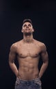 One young man looking above up, shirtless body fit abs Royalty Free Stock Photo