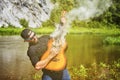 One young man plays the acoustic guitar in nature Royalty Free Stock Photo