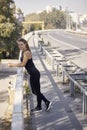 One young smiling woman, 20-29 years old, posing on bridge, Royalty Free Stock Photo