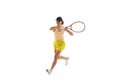 One young teen girl, tennis player in sports uniform playing tennis isolated over white background. Concept of sport Royalty Free Stock Photo