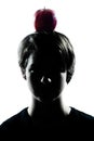 One young teenager boy or girl silhouette with an apple on his h Royalty Free Stock Photo