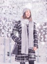 One young woman, coat scarf hat winter laughing Royalty Free Stock Photo