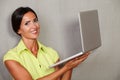 One young woman while holding laptop Royalty Free Stock Photo