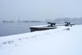 Onega lake embankment with guns in winter