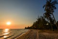 Ong Lang Beach with palms at sunset